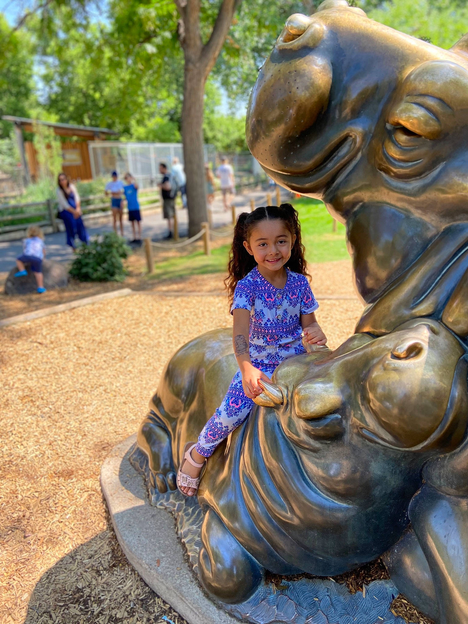 Isabella Lemus is registered to the contest to win money with this photo: art, eye, facial_expression, fawn, fun, grass, happy, joy, lawn_ornament, leisure, monument, person, plant, recreation, sculpture, smile, snout, statue, temple, toddler
