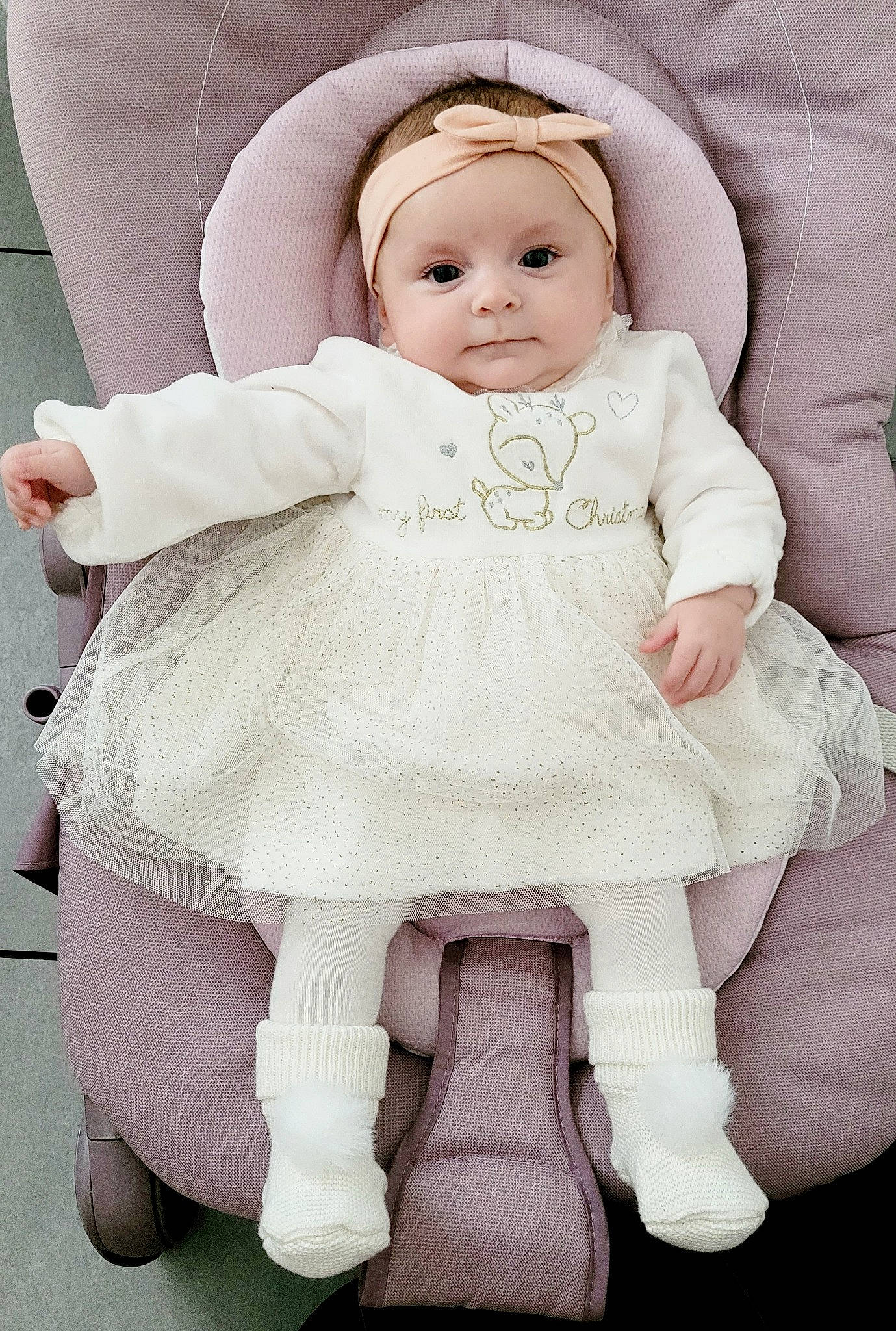 Olympe participe au concours pour gagner de l'argent avec cette photo : arm, baby, baby_toddler_clothing, cheek, chin, doll, eye, eyebrow, eyelash, face, facial_expression, head, headgear, headwear, iris, outerwear, person, pink, skin, sleeve