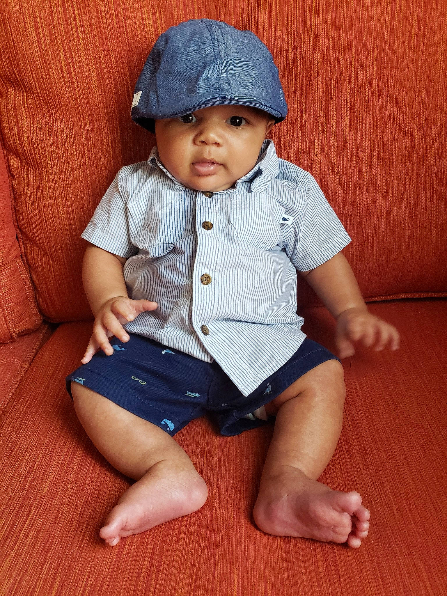Jaspen is registered to the contest to win money with this photo: baby, baby_toddler_clothing, barefoot, cap, child, child_model, hat, headgear, headwear, leg, person, sitting, sleeve, toddler