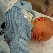 Oakley-Lee joined the competition — help win amazing prizes! newborn, baby, sleeping, blue_sweater, blanket, bed, hospital, infant, peaceful, resting, soft, knitted, child, face, head, indoors, person, cute, portrait, young