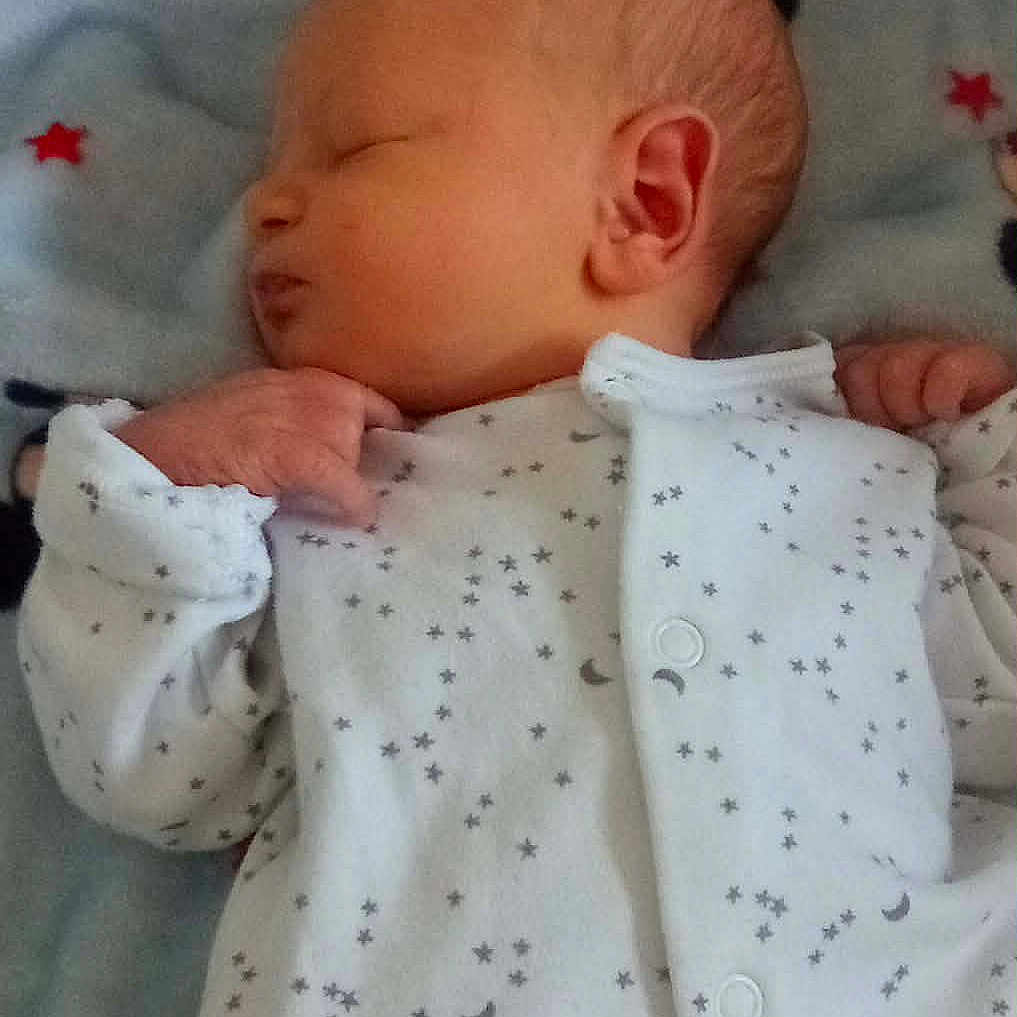 Oakley-Lee is registered to the contest to win money with this photo: baby, bedtime, blanket, child, cozy, cute, ear, face, hand, infant, mickey_mouse, moon, newborn, onesie, peaceful, portrait, sleep, sleeping, soft, stars