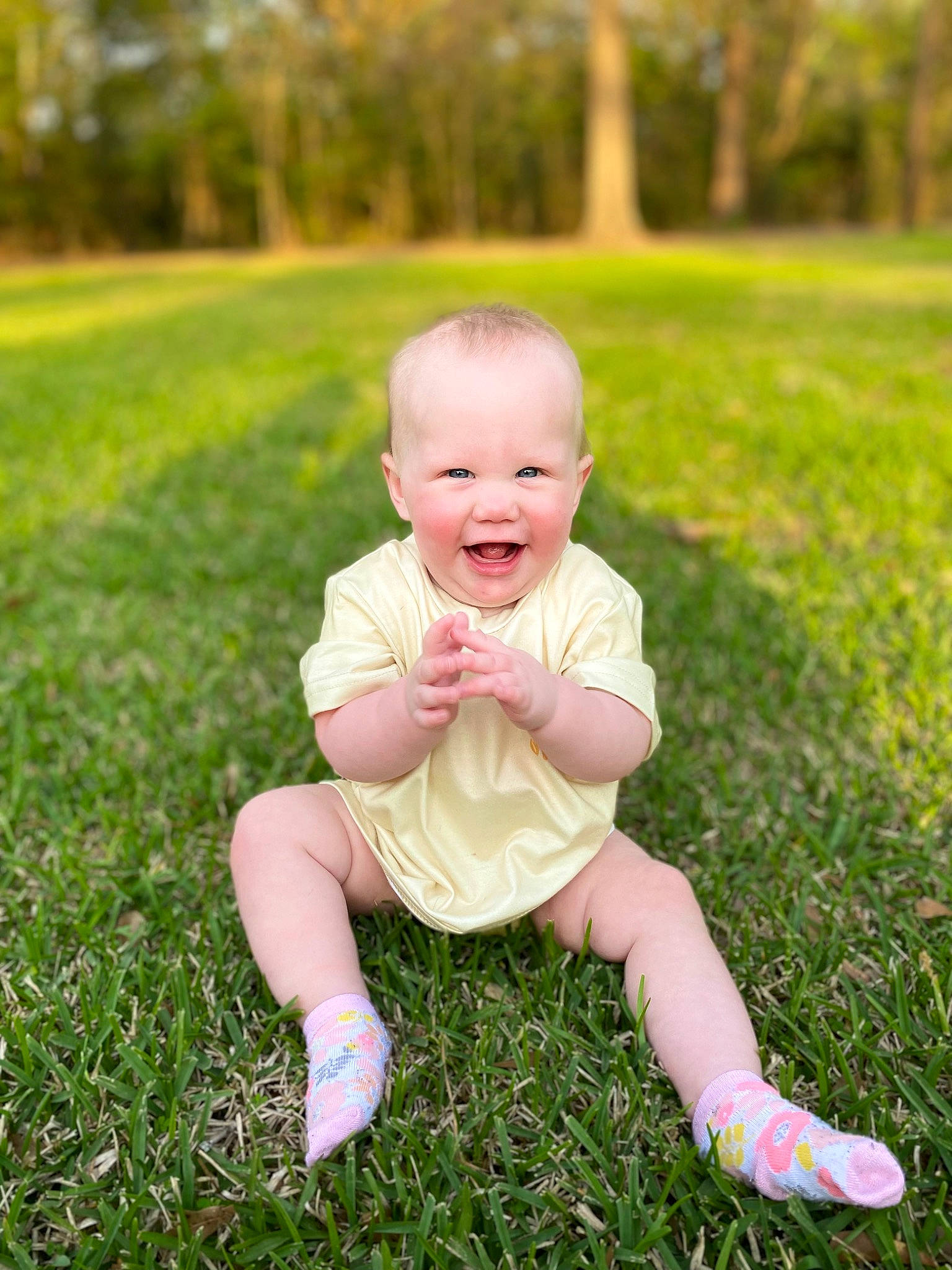 Hartley is registered to the contest to win money with this photo: baby, baby_toddler_clothing, child, flash_photography, grass, grass_family, grassland, happy, lawn, leaf, meadow, people_in_nature, person, plant, playing_with_kids, skin, smile, summer, toddler, tree