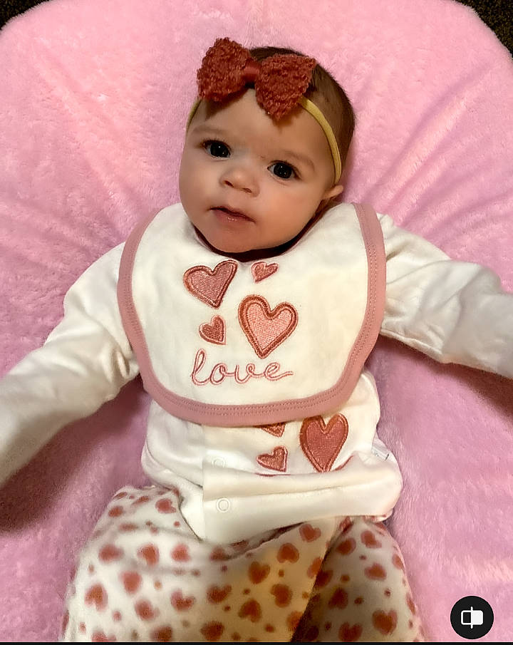 Kayzlee is registered to the contest to win money with this photo: baby, baby_toddler_clothing, cap, carmine, cheek, child, costume_hat, doll, fashion_accessory, fur, happy, headwear, pattern, peach, person, pink, plush, skin, sleeve, stuffed_toy