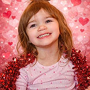 Kayzlee joined the competition — help win amazing prizes! child, girl, smiling, tinsel, red, pink, hearts, background, happy, portrait, holiday, cute, decorative, festive, joyful, young, person, celebration, sparkle, cheerful