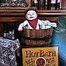 baby, child, wooden_tub, vintage, bandana, cap, poker_chips, sign, hot_bath, soap, towels, tablecloth, lace, bottle, bar, smiling, portrait, indoor, antique, decor