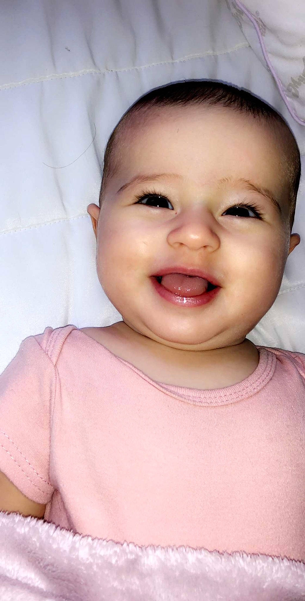 Siena is registered to the contest to win money with this photo: baby, baby_making_funny_faces, beauty, cheek, child, chin, close_up, eye, eyebrow, face, facial_expression, forehead, head, lip, mouth, nose, person, pink, skin, smile