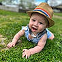 baby, child, hat, grass, outdoor, smiling, blue_clothing, face, crawling, nature, greenery, daytime, happy, cute, person, headwear, infant, grass_field, sunny, playing