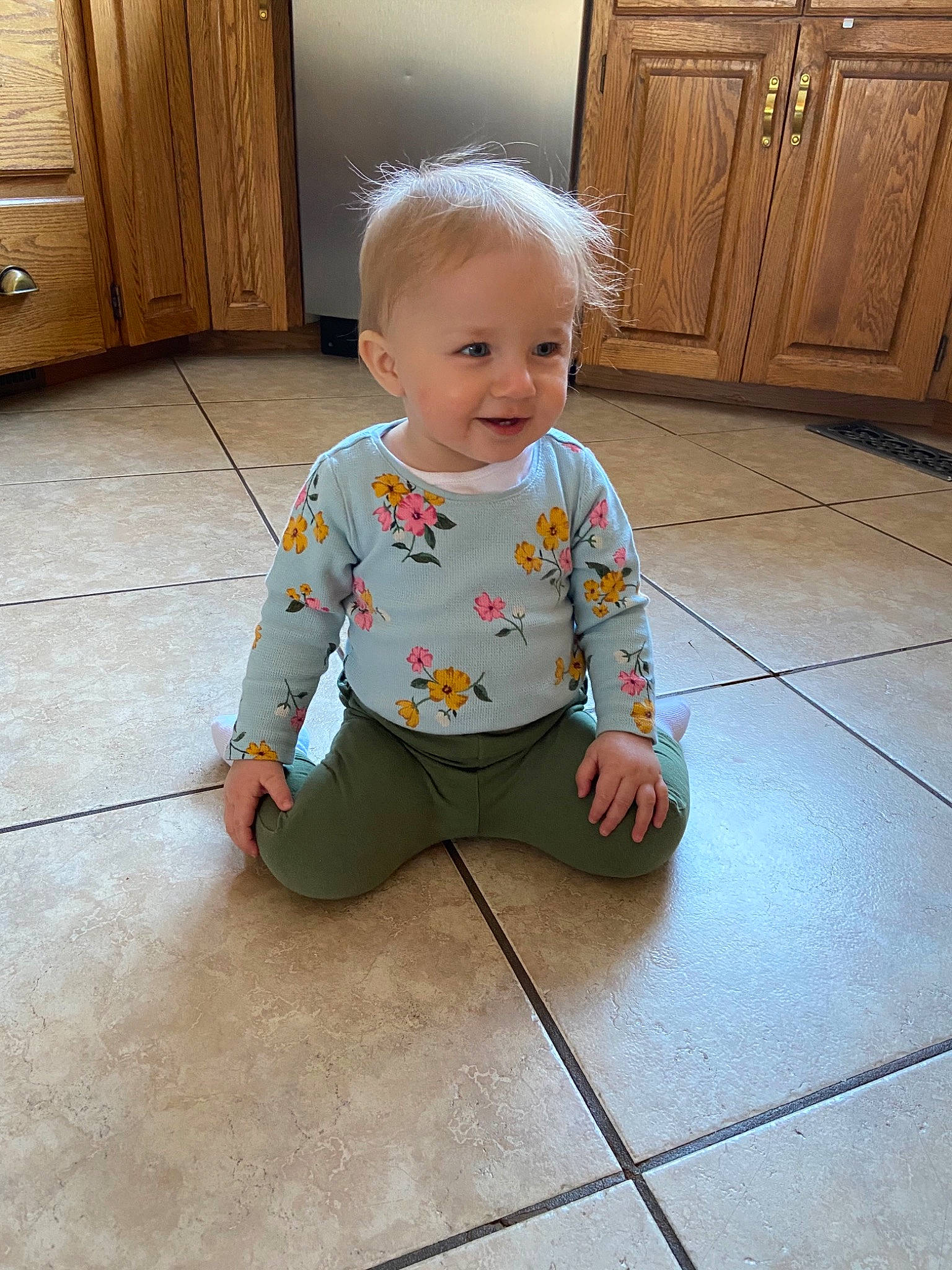Mara is registered to the contest to win money with this photo: baby, baby_toddler_clothing, child, crawling, floor, flooring, joy, person, play, sitting, sleeve, standing, tile, toddler