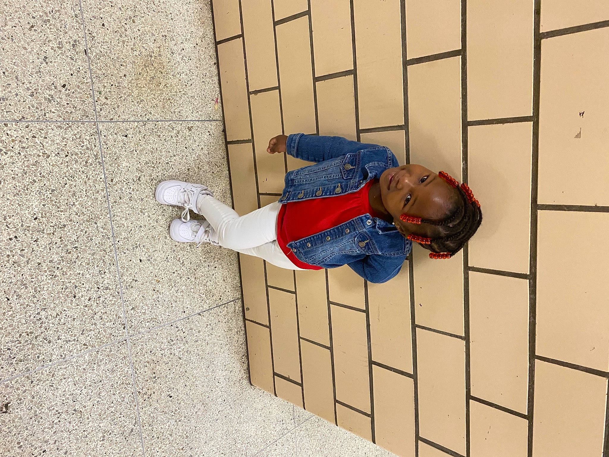 Krystal joined the competition — help win amazing prizes! brick, brickwork, carmine, child, cobblestone, collar, concrete, electric_blue, floor, flooring, happy, pattern, person, rectangle, shadow, sitting, sleeve, smile, wall, wood