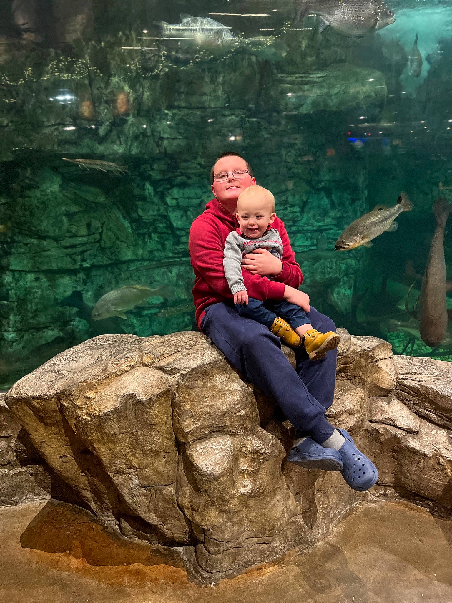 Kooper joined the competition — help win amazing prizes! adventure, bedrock, forest, fun, grass, happy, hat, joy, landscape, leisure, outcrop, people_in_nature, person, recreation, rock, sitting, soil, tourism, travel, tree