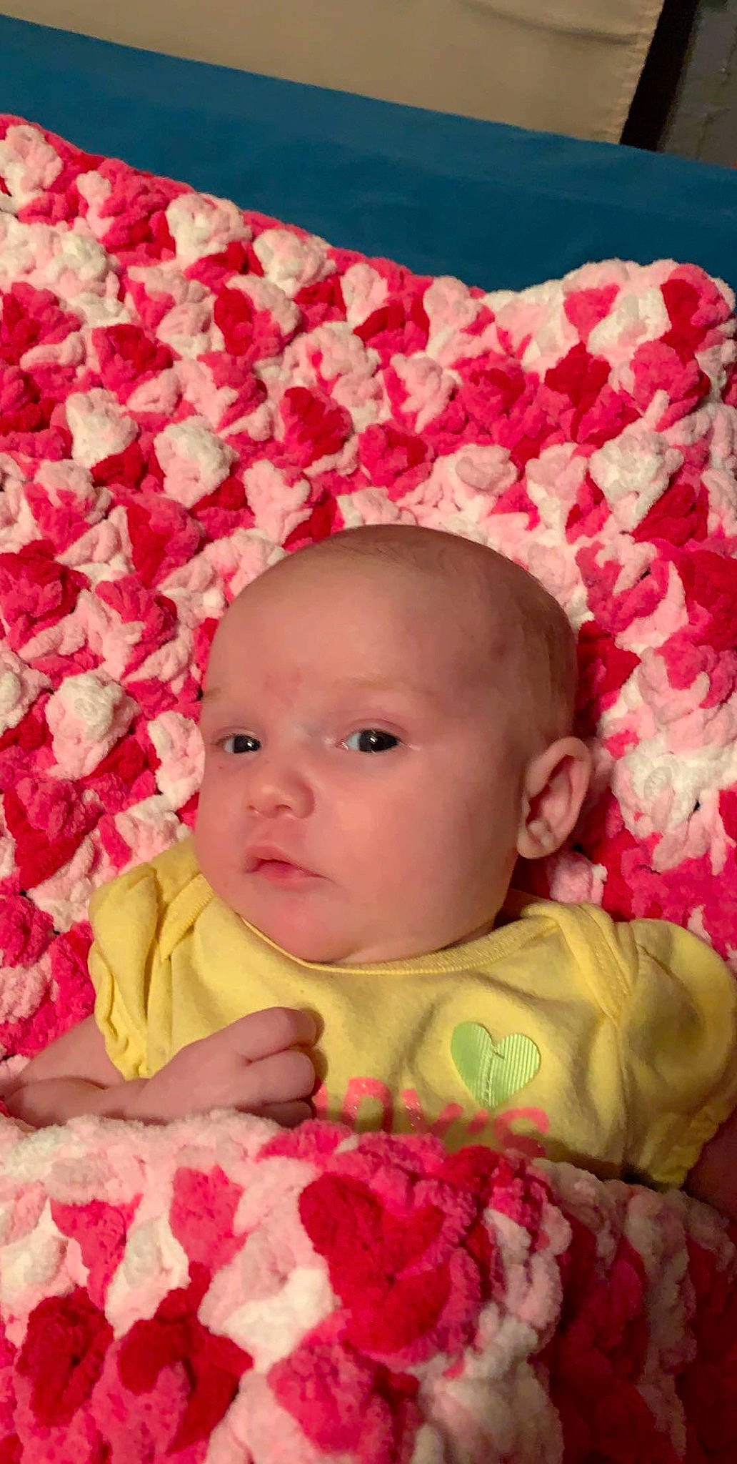 Destinee is registered to the contest to win money with this photo: cheek, child, flower, girl, hair_accessory, infant, lip, person, petal, pink, product, red, rose, rose_family, skin, textile, toddler