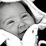 Naya participe au concours pour gagner de l'argent avec cette photo : baby, infant, face, smile, happy, clothing, jacket, zipper, close_up, portrait, child, cute, soft_texture, warm, black_and_white, apparel, hood, young, person, cozy