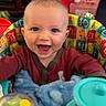 baby, infant, child, smiling, happy, portrait, sitting, activity_seat, toy, rattle, plush, blanket, colorful, indoors, playroom, nursery, chair, clothing, headshot, family_photo
