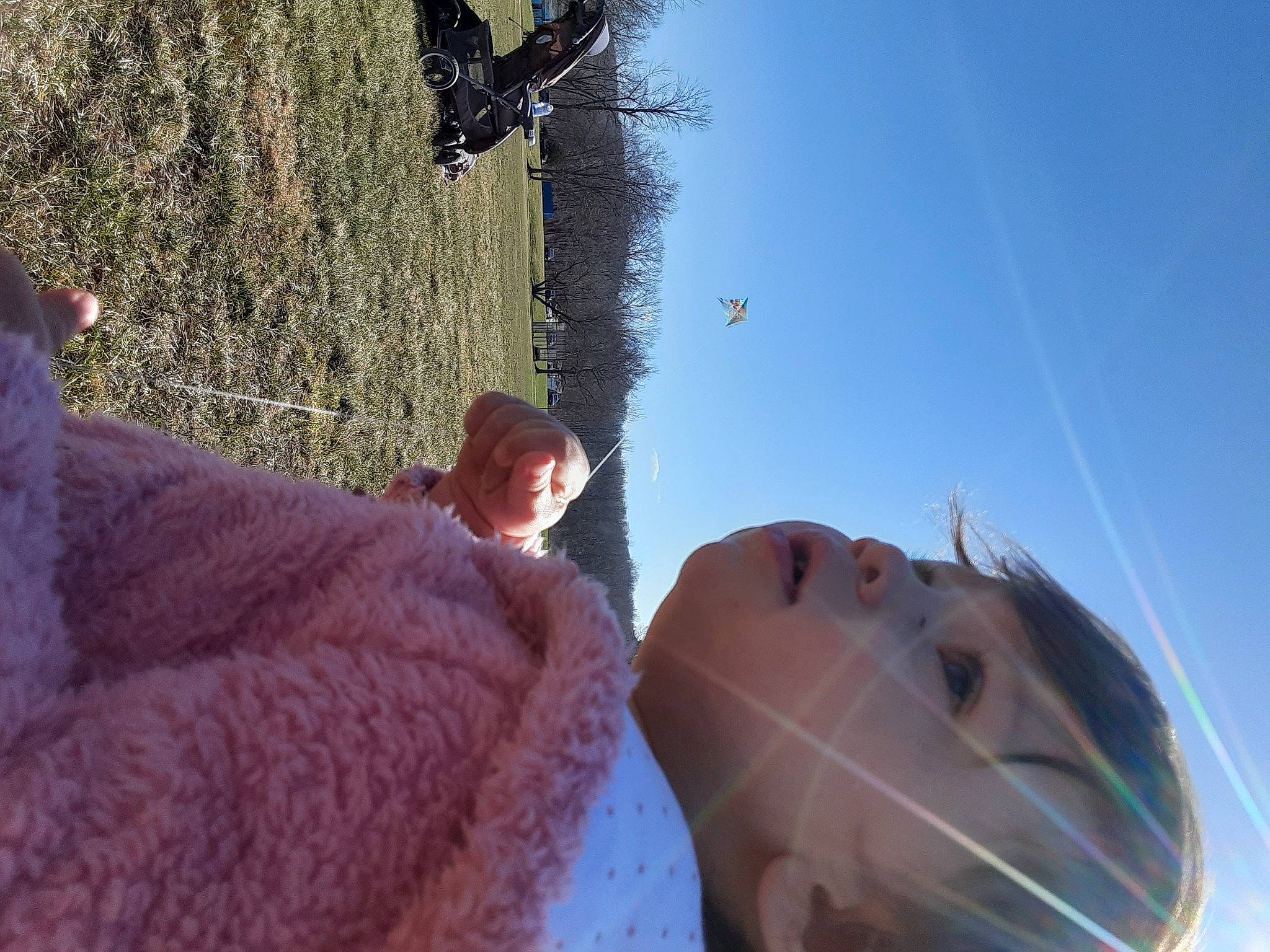 Starla is registered to the contest to win money with this photo: child, eye, eyewear, fun, fur, grass, happy, landscape, leisure, people_in_nature, person, recreation, reflection, rock, sky, sunglasses, toddler, travel, tree, vertebrate