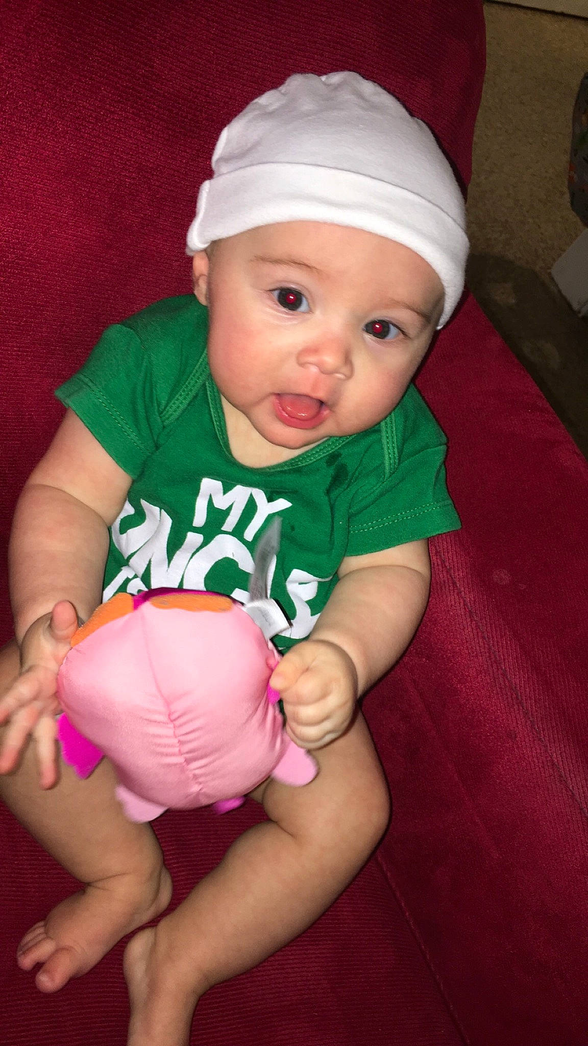 Harlee joined the competition — help win amazing prizes! arm, baby, baby_toddler_clothing, cap, cheek, eye, face, finger, gesture, happy, head, headwear, knee, mouth, person, pink, skin, sleeve, smile, stomach