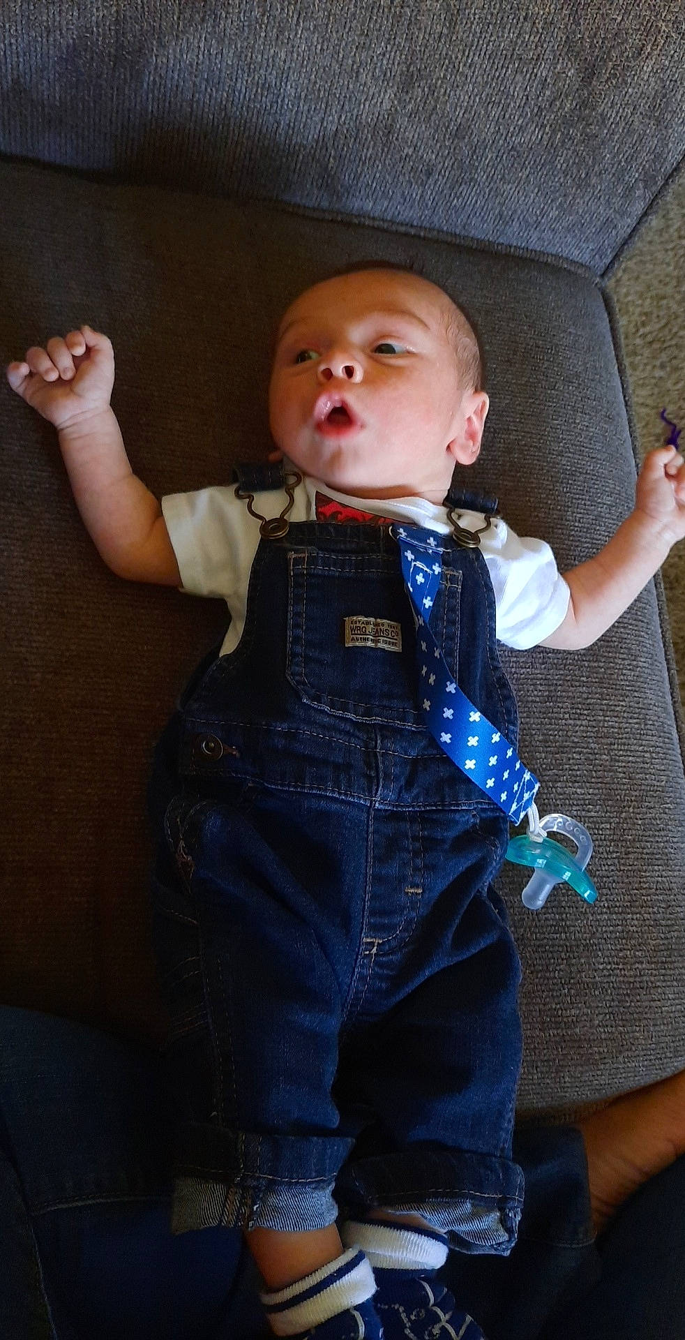Carlo is registered to the contest to win money with this photo: arm, baby, cheek, child, denim, jeans, overall, person, standing, toddler