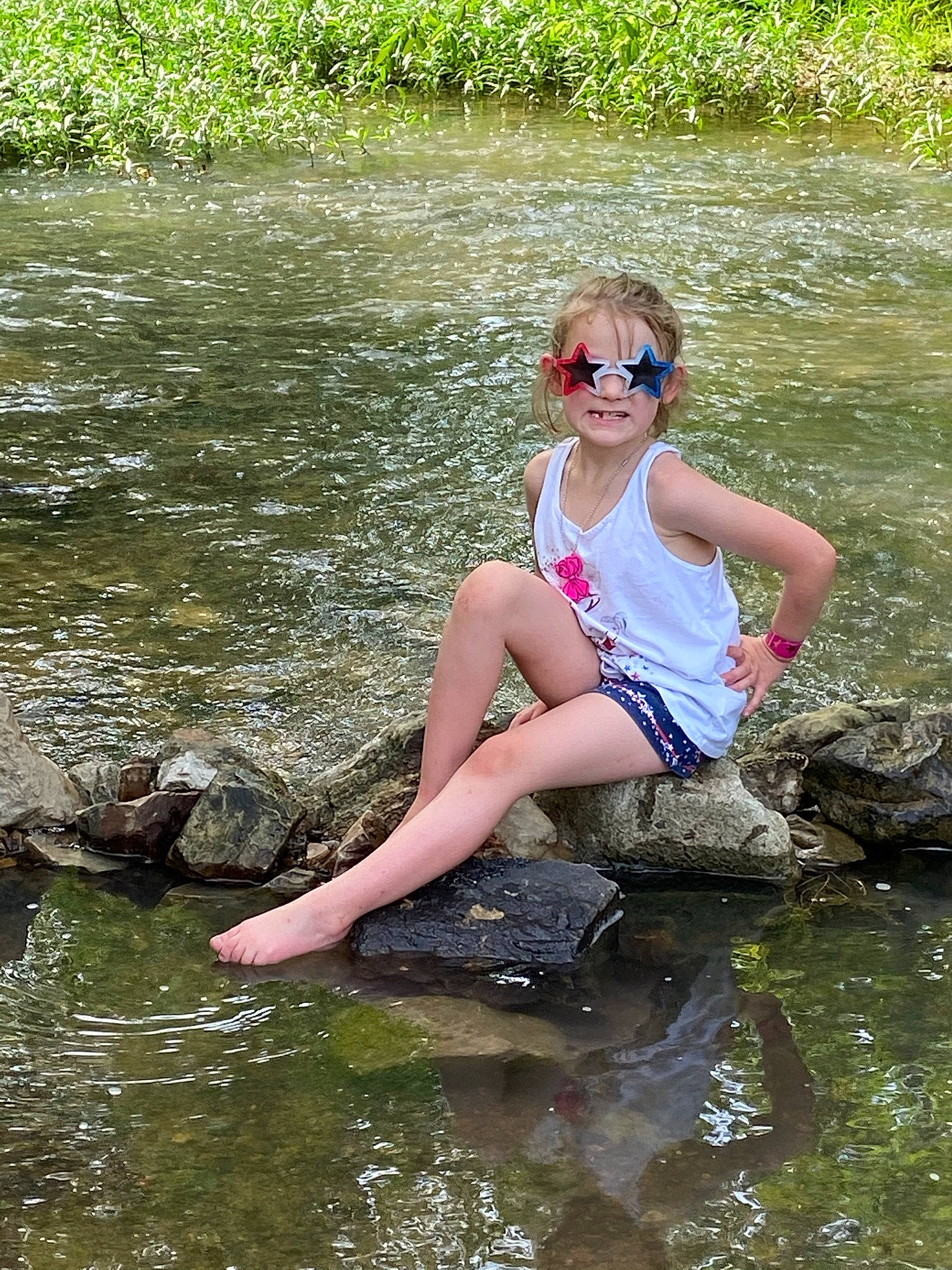Emma Rose joined the competition — help win amazing prizes! bank, eyewear, fluvial_landforms_of_streams, fun, goggles, grass, happy, lake, leisure, natural_environment, outdoor_recreation, people_in_nature, person, plant, recreation, summer, sunglasses, thigh, water, water_resources