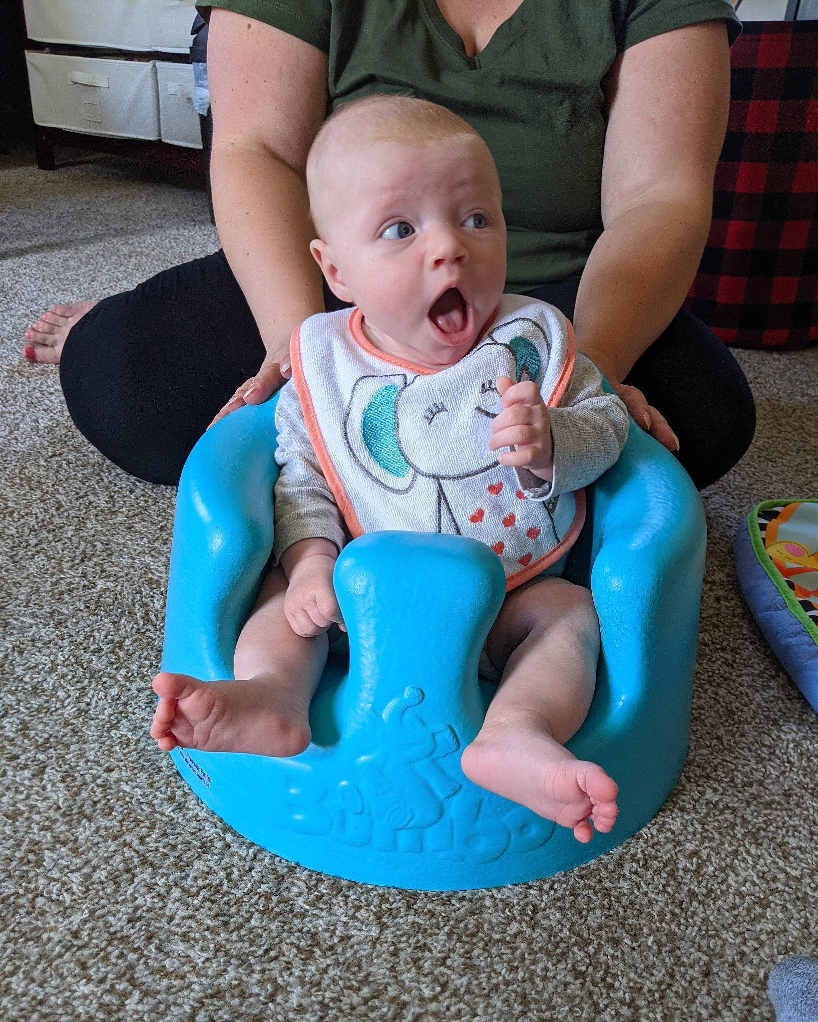 Adella joined the competition — help win amazing prizes! arm, baby, baby_products, baby_toddler_clothing, blue, chair, child, comfort, electric_blue, fun, head, human_body, joint, lap, leisure, person, plaid, sitting, surprise, tartan