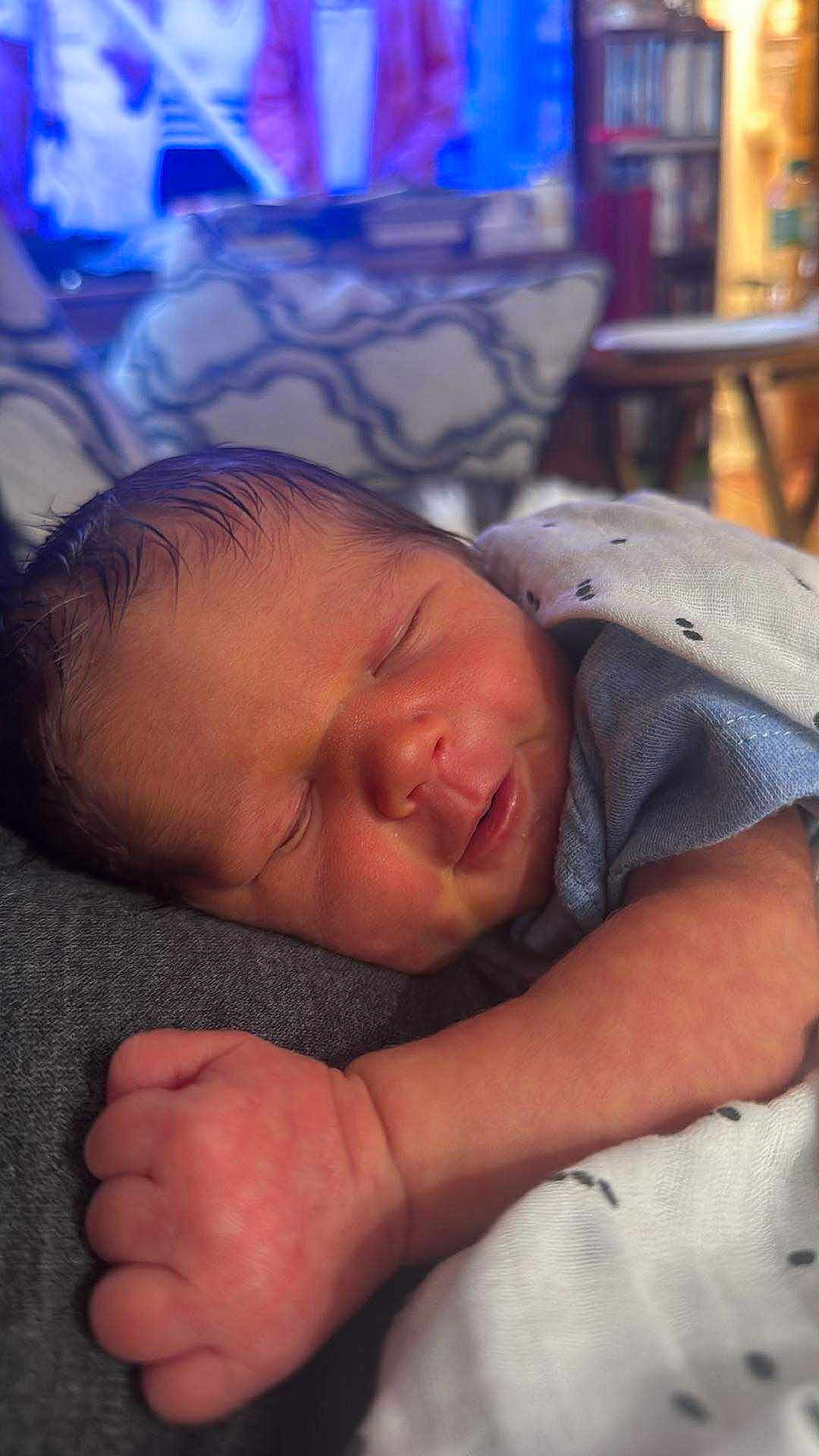 John Benjamin is registered to the contest to win money with this photo: newborn, baby, sleeping, infant, blanket, closeup, face, hand, cozy, soft, peaceful, rest, indoors, person, skin, cute, child, young, portrait, warm