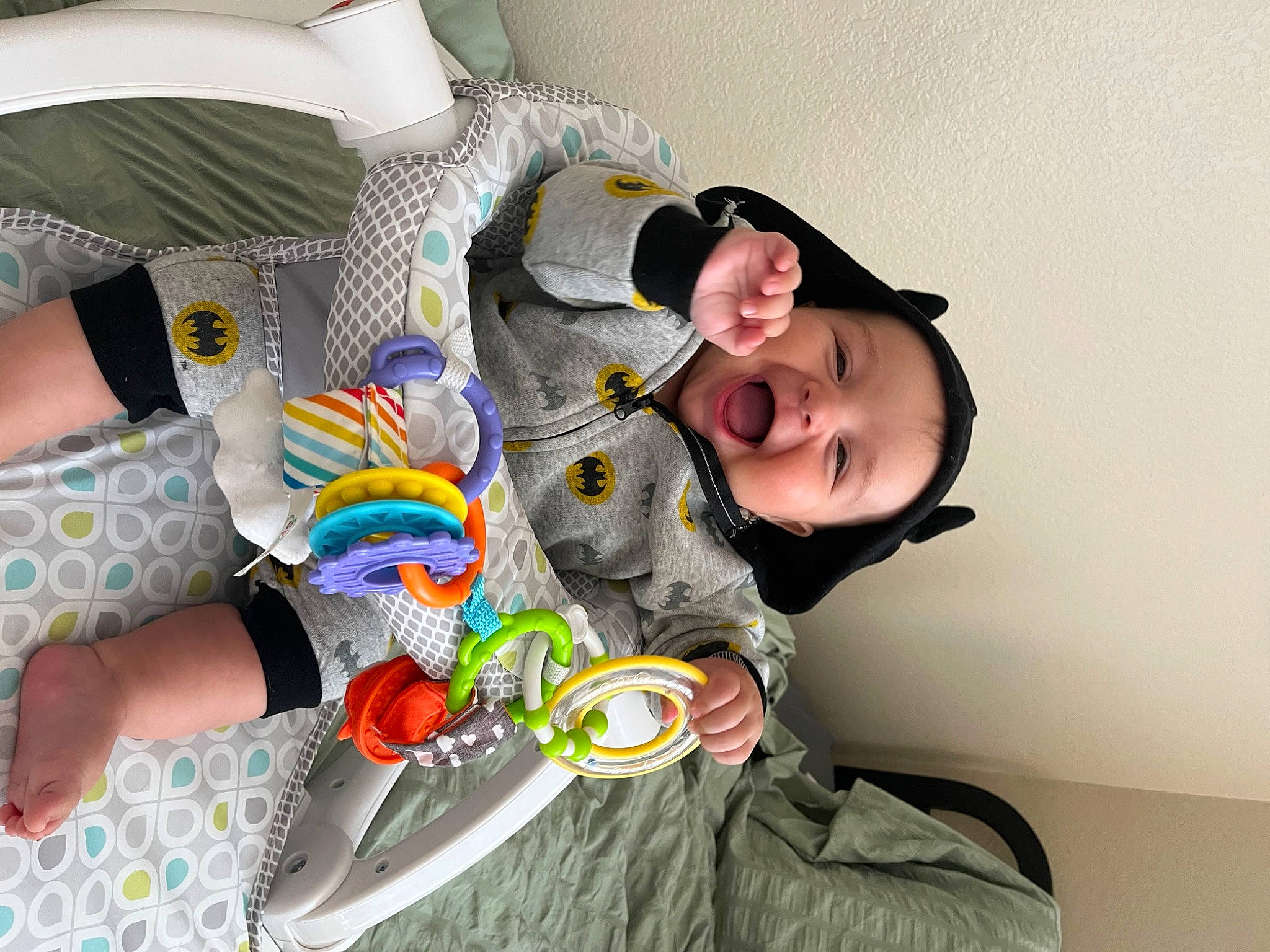 Noah joined the competition — help win amazing prizes! baby, baby_products, child, comfort, couch, fun, happy, headwear, linens, pattern, person, personal_protective_equipment, pillow, play, room, sitting, smile, thigh, toddler