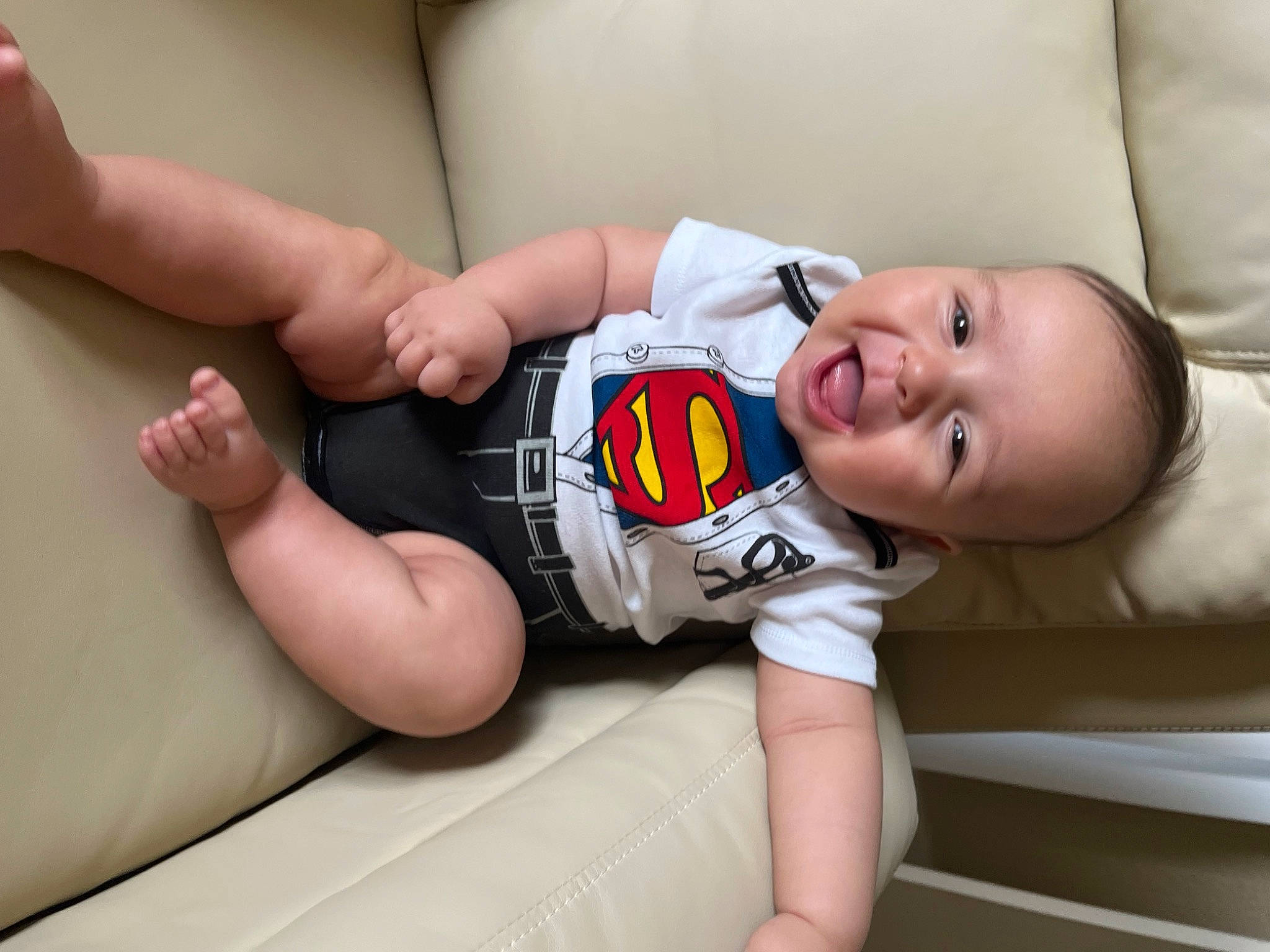 Noah is registered to the contest to win money with this photo: arm, baby, baby_sleeping, baby_toddler_clothing, child, comfort, elbow, finger, flash_photography, hand, happy, human_body, human_leg, joint, knee, leg, person, sleeve, smile, thigh