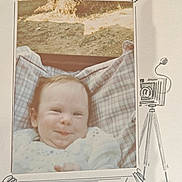 Jeanne participe au concours pour gagner de l'argent avec cette photo : baby, infant, smile, plaid, pillow, outdoor, vintage_photo, portrait, child, cute, face, expression, blanket, candid, soft_lighting, cheeky, scrapbook, doodle, camera, photography
