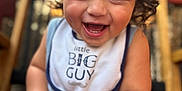 Micaden is registered to the contest to win money with this photo: baby, child, smiling, happy, face, hair, bib, clothing, arm, hand, foot, skin, sitting, portrait, indoors, cute, infant, expression, closeup, person