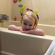Troy is registered to the contest to win money with this photo: bath_time, bathroom, bathtub, bathtub_faucet, child, colorful, curious, face, foam_toys, home, interior, playful, relaxing, skin, toddler, towel, toy, water, water_drops, wet_hair