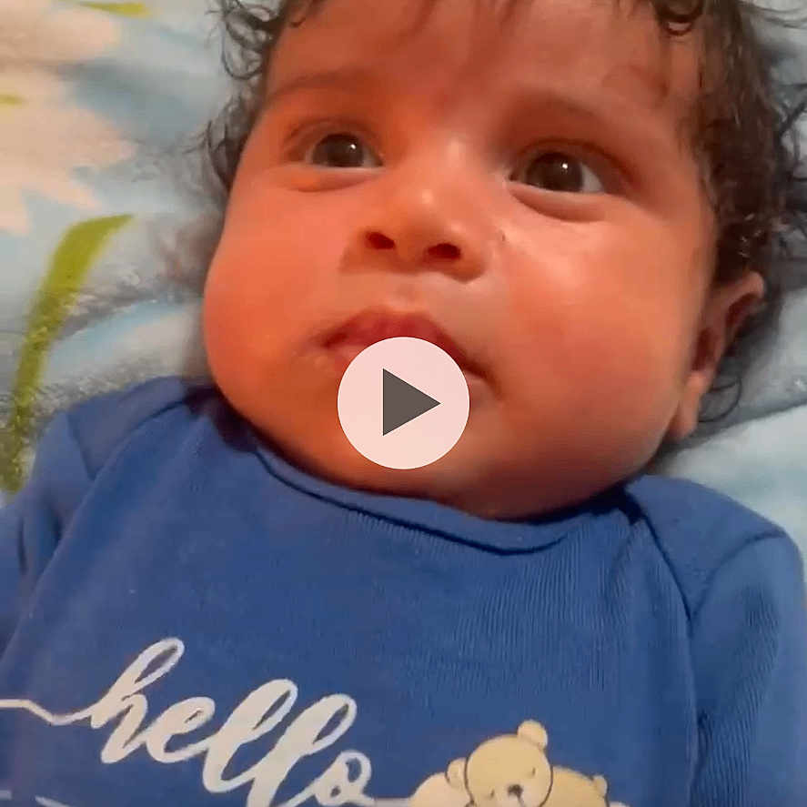 Firas Nayel Bouabbad joined the competition — help win amazing prizes! baby, infant, face, blue_shirt, teddy_bear, blanket, curly_hair, close_up, lying_down, indoor, child, cute, expression, portrait, person, skin, young_child, head, eyes, clothing