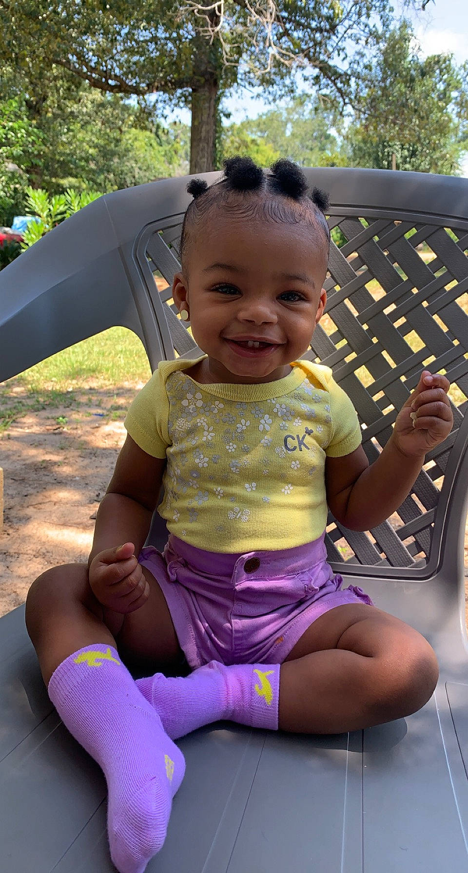 Aaliyah is registered to the contest to win money with this photo: baby_toddler_clothing, child, cool, facial_expression, fun, grass, happy, joy, lap, leg, leisure, mouth, people, person, pink, public_space, purple, recreation, skin, smile