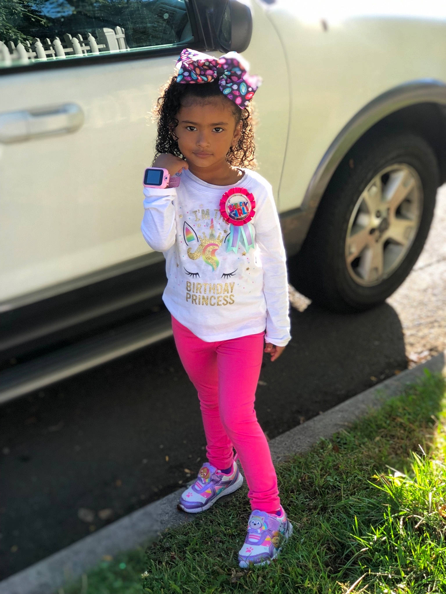 Jaslynn is registered to the contest to win money with this photo: car, child, clothing, fashion, headgear, outerwear, person, pink, plant, shoe, sleeve, street_fashion, t_shirt, tights, toddler, trousers, vacation, vehicle