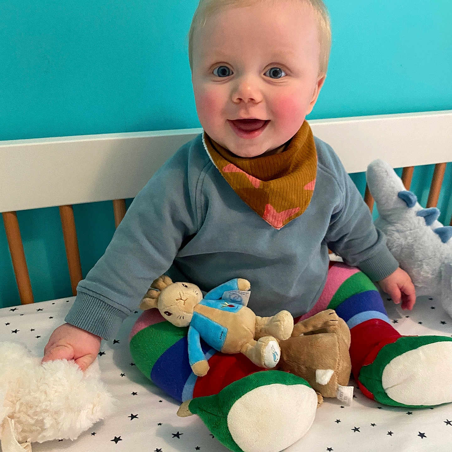 Oscar is registered to the contest to win money with this photo: baby, bed, blanket, blonde, clothing, crawling, crib, cushion, face, furniture, hair, head, homedecor, hosiery, indoors, infantbed, nursery, person, photography, pillow