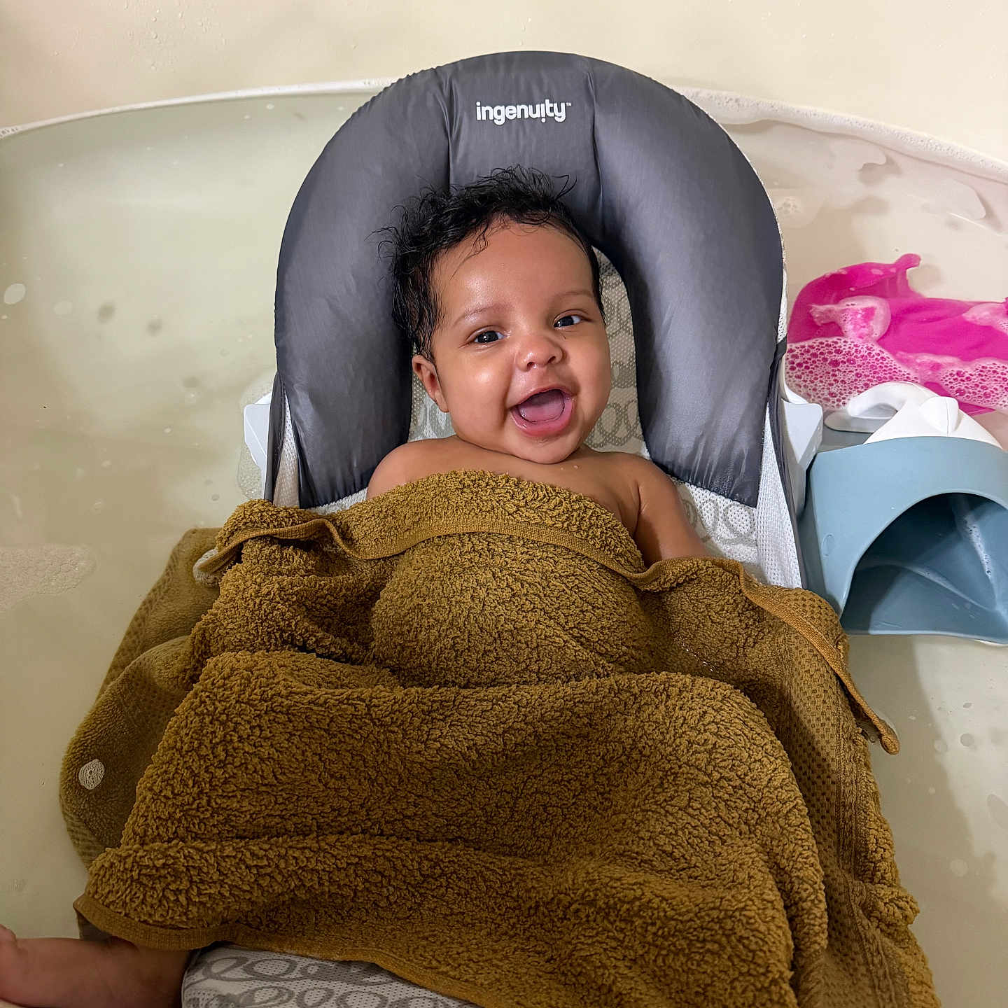 Ariannah joined the competition — help win amazing prizes! baby, child, bath, towel, smile, happy, water, bath_toy, seat, infant, person, indoors, childcare, bathtub, cute, relaxing, skin, head, face, comfort
