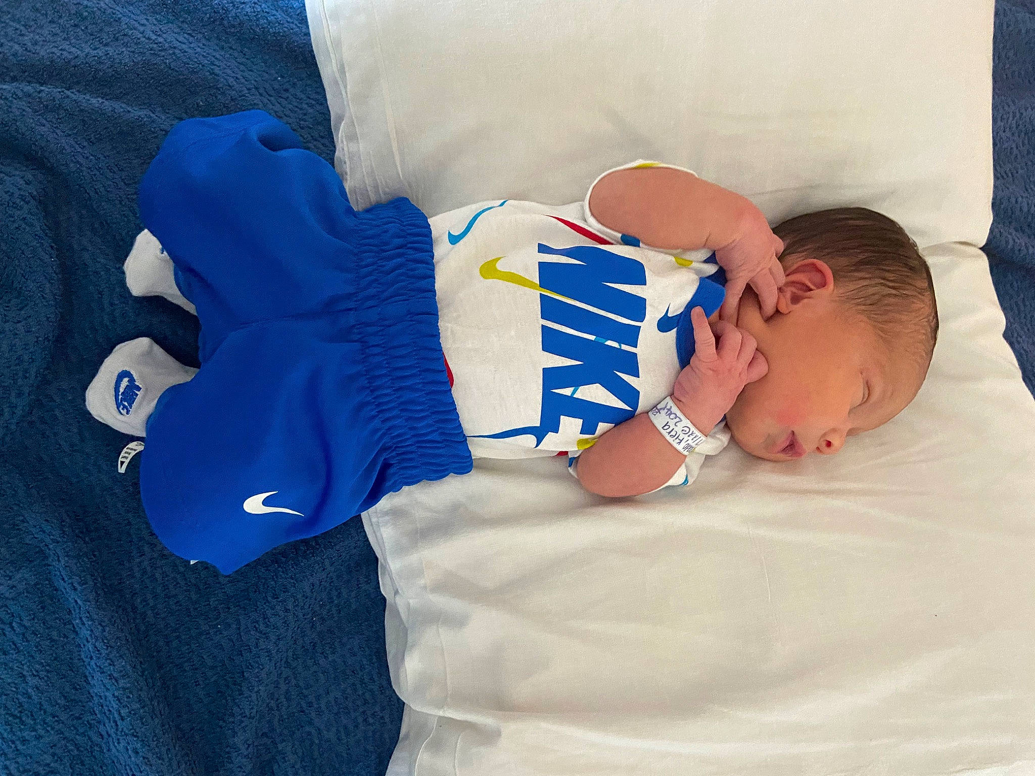 Marco is registered to the contest to win money with this photo: abdomen, baby, baby_products, baby_sleeping, baby_toddler_clothing, blue, comfort, couch, elbow, electric_blue, finger, gesture, hand, human_body, linens, person, sleeve, t_shirt, toddler, trunk