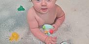 Charlotte joined the competition — help win amazing prizes! baby, child, bathtub, bubble_bath, bath_toy, rubber_duck, foam, water, towel, bathroom, tub, toy, wet_hair, blue_eyes, face, hand, arm, skin, cute, splash