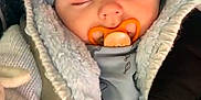Marley participe au concours pour gagner de l'argent avec cette photo : baby, bonnet, clothing, eating, face, food, hat, head, person, yawning