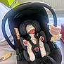 Elizabeth participe au concours pour gagner de l'argent avec cette photo : baby, baby_carrier, bed, blanket, car_seat, child, green_furniture, handle, hat, indoor, infant, newborn, nursery, peaceful, resting, sleeping, soft_toy, strap, toy, white_clothing