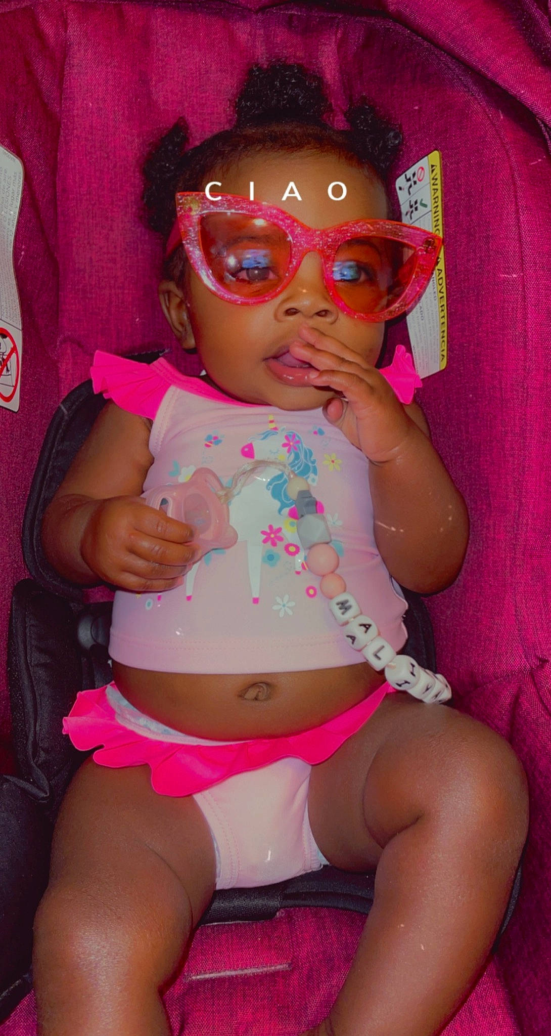 Maliyah joined the competition — help win amazing prizes! arm, baby_toddler_clothing, black_hair, chest, eye, face, facial_expression, hair, hairstyle, head, human_body, magenta, mouth, person, pink, shorts, skin, stomach, thigh, toddler