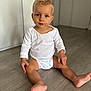 toddler, child, baby, sitting, floor, white_onesie, blonde_hair, blue_eyes, indoor, wooden_floor, curious, portrait, casual_clothing, young_child, cute, hands, feet, face, person, innocent