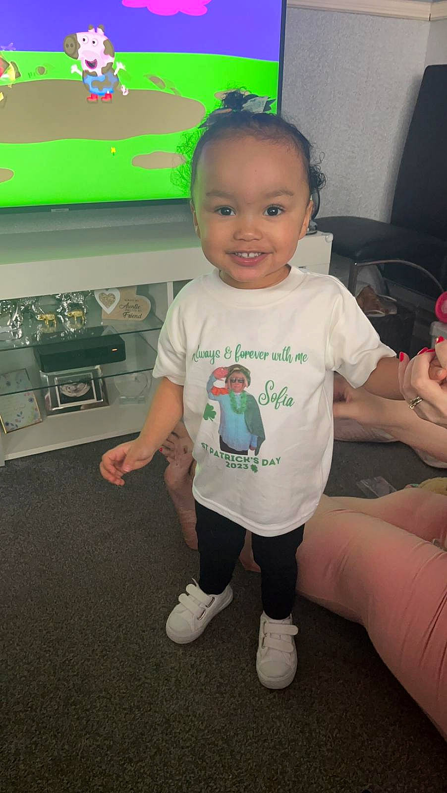Sofia is registered to the contest to win money with this photo: baby, baby_toddler_clothing, child, flooring, fun, happy, human_leg, joint, joy, knee, motor_vehicle, person, product, shorts, skin, sleeve, smile, standing, t_shirt, thigh
