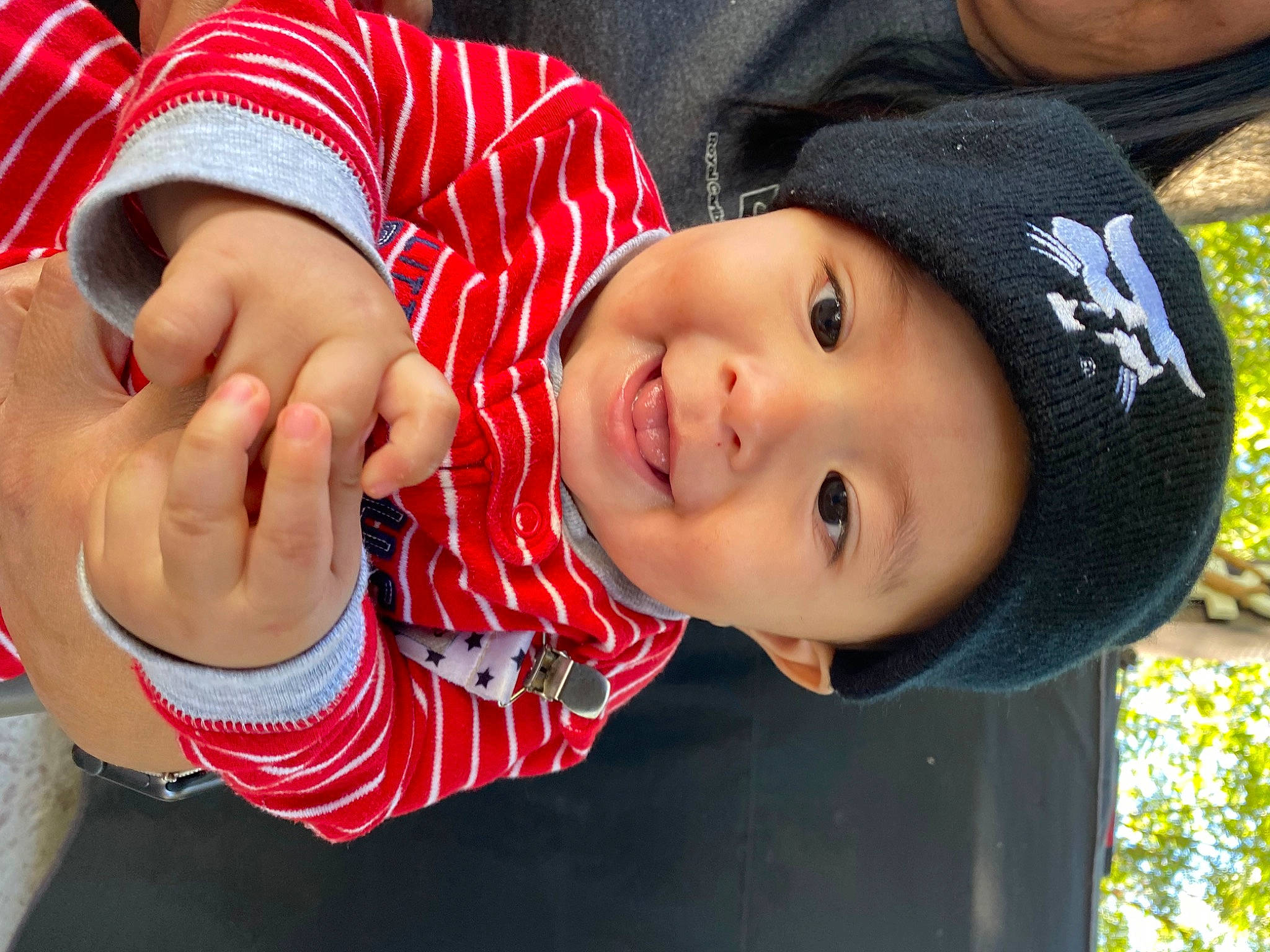 Aiden is registered to the contest to win money with this photo: baby, baby_toddler_clothing, cap, child, fashion_accessory, fun, gesture, grass, happy, hat, headwear, leisure, lip, nail, nose, person, plant, skin, smile, sun_hat