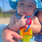 Legend joined the competition — help win amazing prizes! baby, baseballcap, bodypart, cap, clothing, face, finger, hand, hat, head, lifejacket, person, photography, pool, portrait, summer, sunhat, swimwear, vest, water