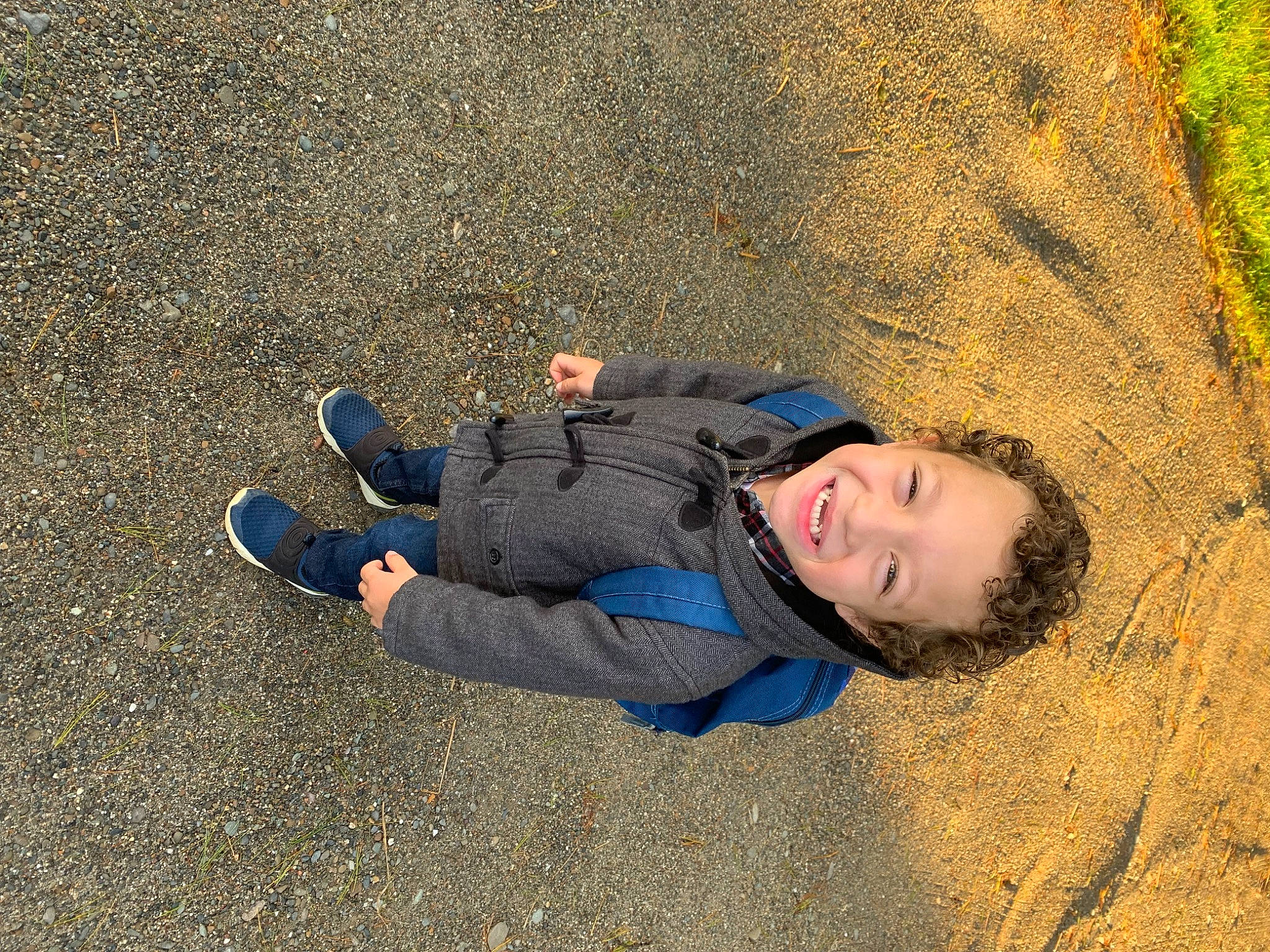 Dawson is registered to the contest to win money with this photo: asphalt, denim, electric_blue, fun, grass, happy, joy, landscape, leisure, people_in_nature, person, plant, road_surface, sand, shadow, smile, soil, tints_and_shades, tree