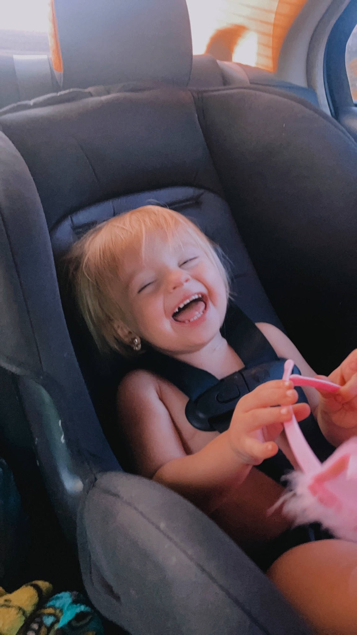 Liberty is registered to the contest to win money with this photo: auto_part, automotive_design, baby_in_car_seat, car_seat, car_seat_cover, comfort, eye, family_car, fun, gesture, happy, head_restraint, motor_vehicle, person, personal_luxury_car, seat_belt, smile, steering_part, steering_wheel, toddler