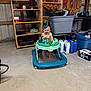 Nevaeh is registered to the contest to win money with this photo: baby, walker, bow, smile, indoor, garage, shelf, container, floor, toy, person, clothing, plastic, storage, sign, industrial, happy, headband, cans, box