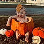 Nevaeh joined the competition — help win amazing prizes! baby, pumpkin, headband, tongue_out, outdoor, grass, autumn, fall, cute, child, orange, decor, smile, feet, hand, seasonal, small_pumpkin, wooden_sign, holiday, playful