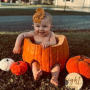 Nevaeh joined the competition — help win amazing prizes! baby, pumpkin, headband, tongue_out, outdoor, grass, autumn, fall, cute, child, orange, decor, smile, feet, hand, seasonal, small_pumpkin, wooden_sign, holiday, playful