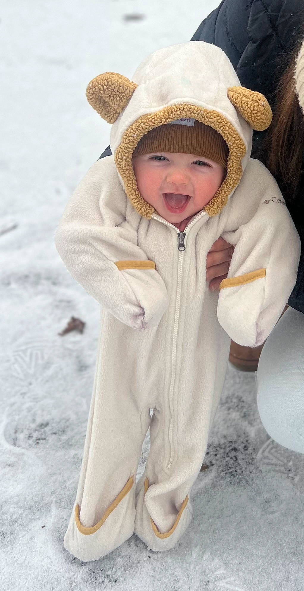 Oaklee joined the competition — help win amazing prizes! baby, cap, child, face, fashion_accessory, freezing, fur, gesture, glove, happy, headwear, hood, jacket, knit_cap, parka, person, playing_in_the_snow, sleeve, snow, toddler