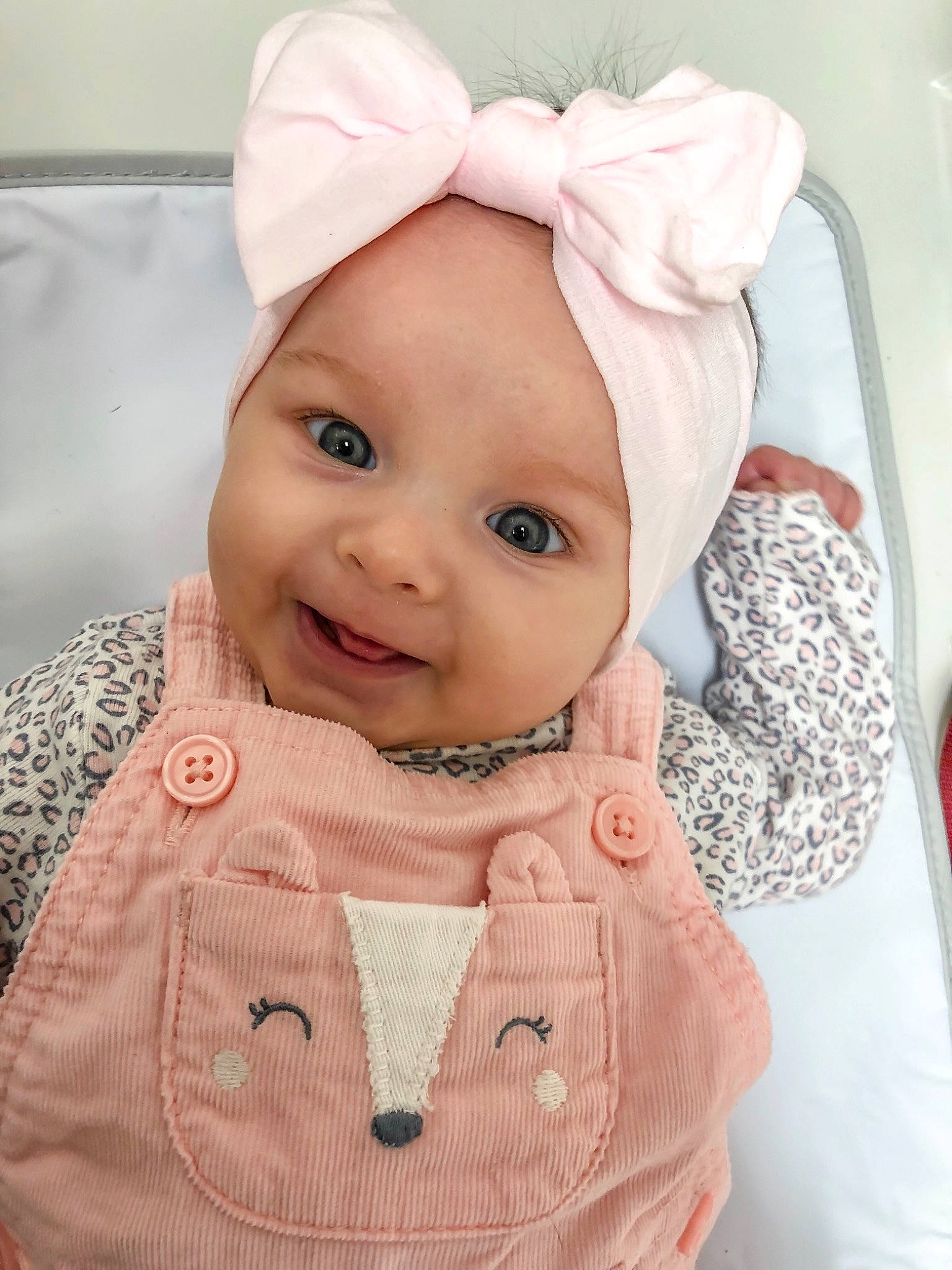 Brinley joined the competition — help win amazing prizes! bonnet, cheek, child, ear, face, girl, hair_accessory, head, headband, headgear, infant, person, pink, product, skin, smile, textile, toddler