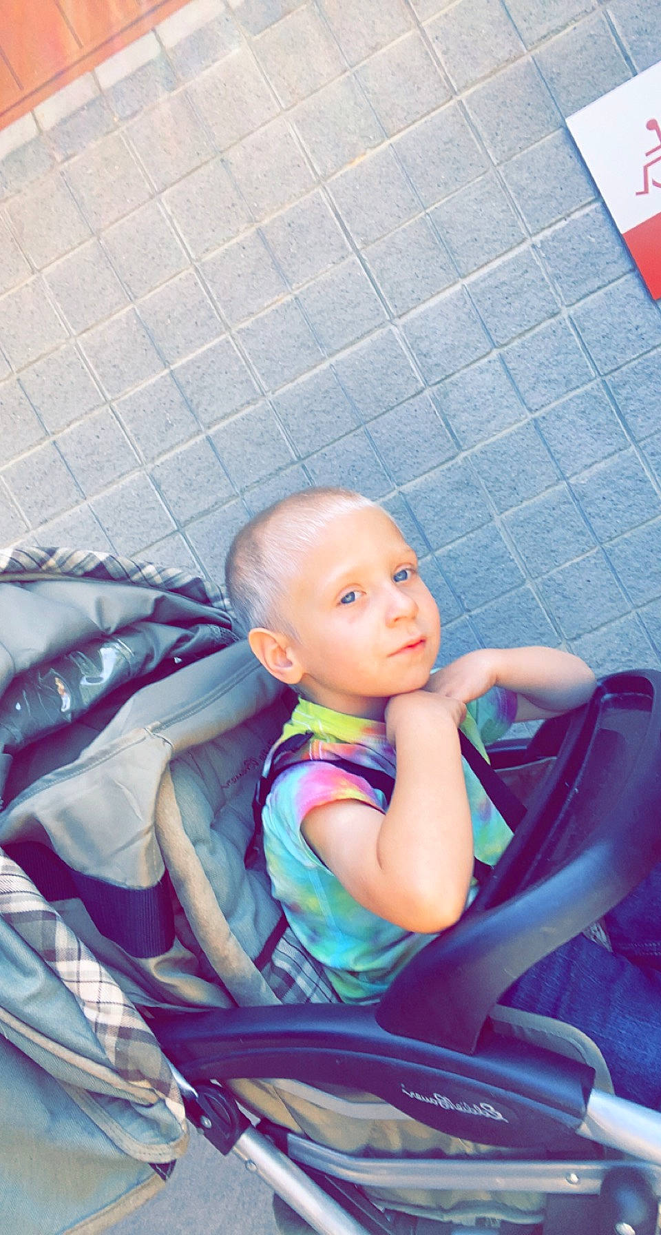 Bentley is registered to the contest to win money with this photo: arm, auto_part, baby, baby_carriage, baby_products, baby_toddler_clothing, car_seat, chair, child, comfort, cool, electric_blue, flooring, fun, lap, leisure, person, sitting, toddler, vacation